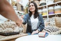 Asian business woman and client make deal by shaking hands over laptop computer Royalty Free Stock Photo