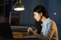 Asian business woman drink coffee refreshing working overtime la Royalty Free Stock Photo