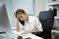 Asian business women feel tired from work. She wants to relax