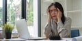 Asian business woman got stressed at work during in the office room, stressed face while working Royalty Free Stock Photo