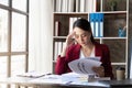 asian business woman got stressed at work during in the office room, unhappy face while working Royalty Free Stock Photo