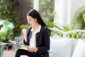 Asian business woman holding clipboard folder and gesture glad Royalty Free Stock Photo