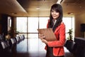 Asian business woman holding clipboard Royalty Free Stock Photo