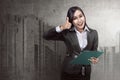 Asian business woman holding clipboard Royalty Free Stock Photo