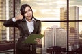 Asian business woman holding clipboard Royalty Free Stock Photo