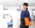 Asian business woman holding folder Royalty Free Stock Photo