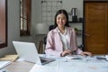 Asian business woman in the home office, doing planning analyzing the financial report, business plan investment Royalty Free Stock Photo