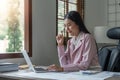 Asian business woman in the home office, doing planning analyzing the financial report, business plan investment Royalty Free Stock Photo