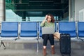 Asian business woman in international airport terminal, working on her laptop while waiting for flight Royalty Free Stock Photo