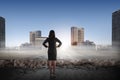 Asian business woman looking the city from broken road