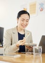 Asian business woman, office and sushi on lunch break, video or movie on laptop with thinking, relax and happy. Japanese Royalty Free Stock Photo