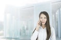 Asian business woman office worker communicating with mobile phone. Royalty Free Stock Photo