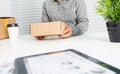 Asian business woman with package box