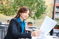 Asian Business Woman Reading Newspaper Royalty Free Stock Photo