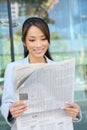 Asian Business Woman Reading Newspaper Royalty Free Stock Photo