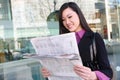 Asian Business Woman Reading Newspaper Royalty Free Stock Photo