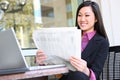 Asian Business Woman Reading Newspaper Royalty Free Stock Photo