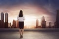 Asian business woman on the roof and looking at the city Royalty Free Stock Photo