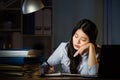 Asian business woman sleepy working overtime late night Royalty Free Stock Photo