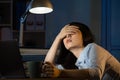 Asian business woman sleepy working overtime late night Royalty Free Stock Photo