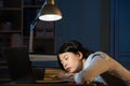 Asian business woman sleepy working overtime late night