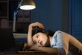 Asian business woman sleepy working overtime late night Royalty Free Stock Photo