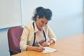 Business woman signing contract agreement in office Royalty Free Stock Photo