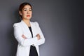 Asian business woman standing confident on gray background Royalty Free Stock Photo