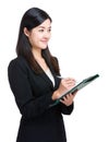 Asian business woman take note on clipboard Royalty Free Stock Photo