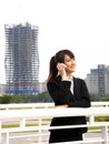 Asian business woman talking on the phone Royalty Free Stock Photo