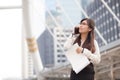 Asian business woman talking smart phone. Royalty Free Stock Photo