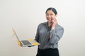 Asian business woman talking telephone with hand holding laptop Royalty Free Stock Photo