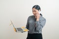 Asian business woman talking telephone with hand holding laptop Royalty Free Stock Photo