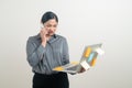 Asian business woman talking telephone with hand holding laptop Royalty Free Stock Photo