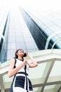 Asian business woman telephoning outside with phone