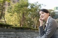 Asian business woman thinking in the city Royalty Free Stock Photo