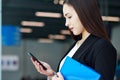 Asian Business woman using mobile phone. Portrait of beautiful girl in office or meeting room Royalty Free Stock Photo