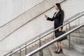 Asian business woman using mobile smartphone outside office Royalty Free Stock Photo