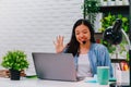 Asian business woman work from home with laptop computer on table with meeting online and video conferencing.Concept of social Royalty Free Stock Photo