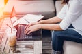 Asian Business woman work typing on laptop with graph data on screen Royalty Free Stock Photo