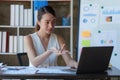 Asian Business woman working at home office and analyze financial report document. Accounting and Finance concept Royalty Free Stock Photo