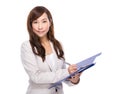 Asian business woman write on clipboard Royalty Free Stock Photo