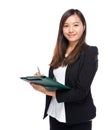 Asian business woman write on clipboard Royalty Free Stock Photo