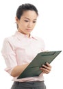 Asian business woman write on file pad Royalty Free Stock Photo