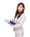 Asian business woman write on note pad Royalty Free Stock Photo