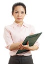 Asian business woman with writing pad Royalty Free Stock Photo