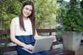 Asian business women using notebook and smiling happy for working at outdoor Royalty Free Stock Photo