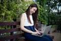 Asian business women using notebook for working at outdoor Royalty Free Stock Photo