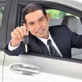 Asian businessman as a driver giving a car key