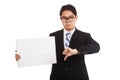 Asian businessman in bad mood thumbs down hold blank sign Royalty Free Stock Photo